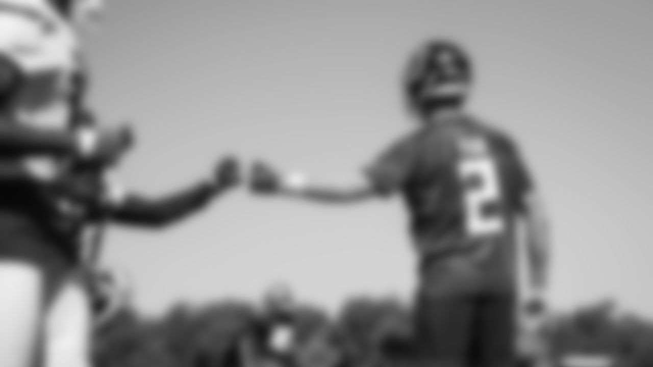 Atlanta Falcons quarterback Matt Ryan #2 gives a fist bump during practice at IBM Performance Field. (Photo by Kara Durrette/Atlanta Falcons)
