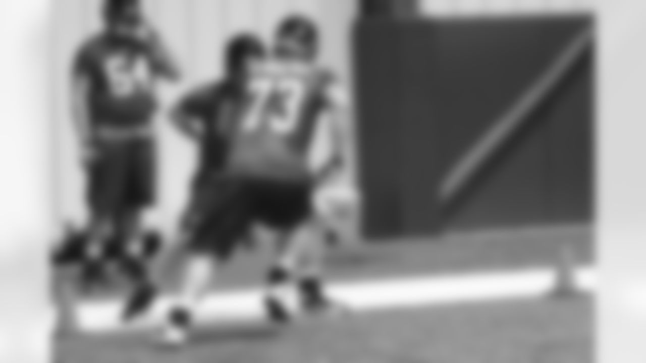 Tackles Ryan Schrader and Will Post work together on a drill