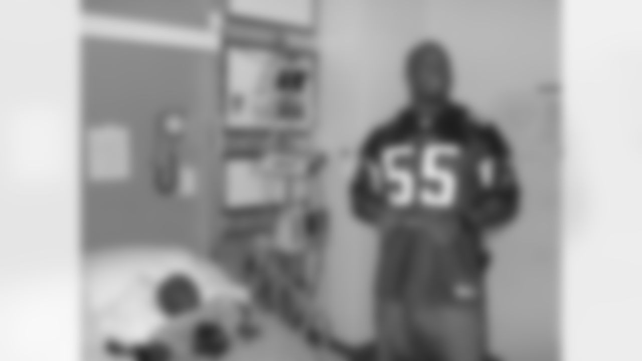 The Atlanta Facons visit Children's Healthcare of Atlanta // Atlanta, GA // John Abraham with a patient //