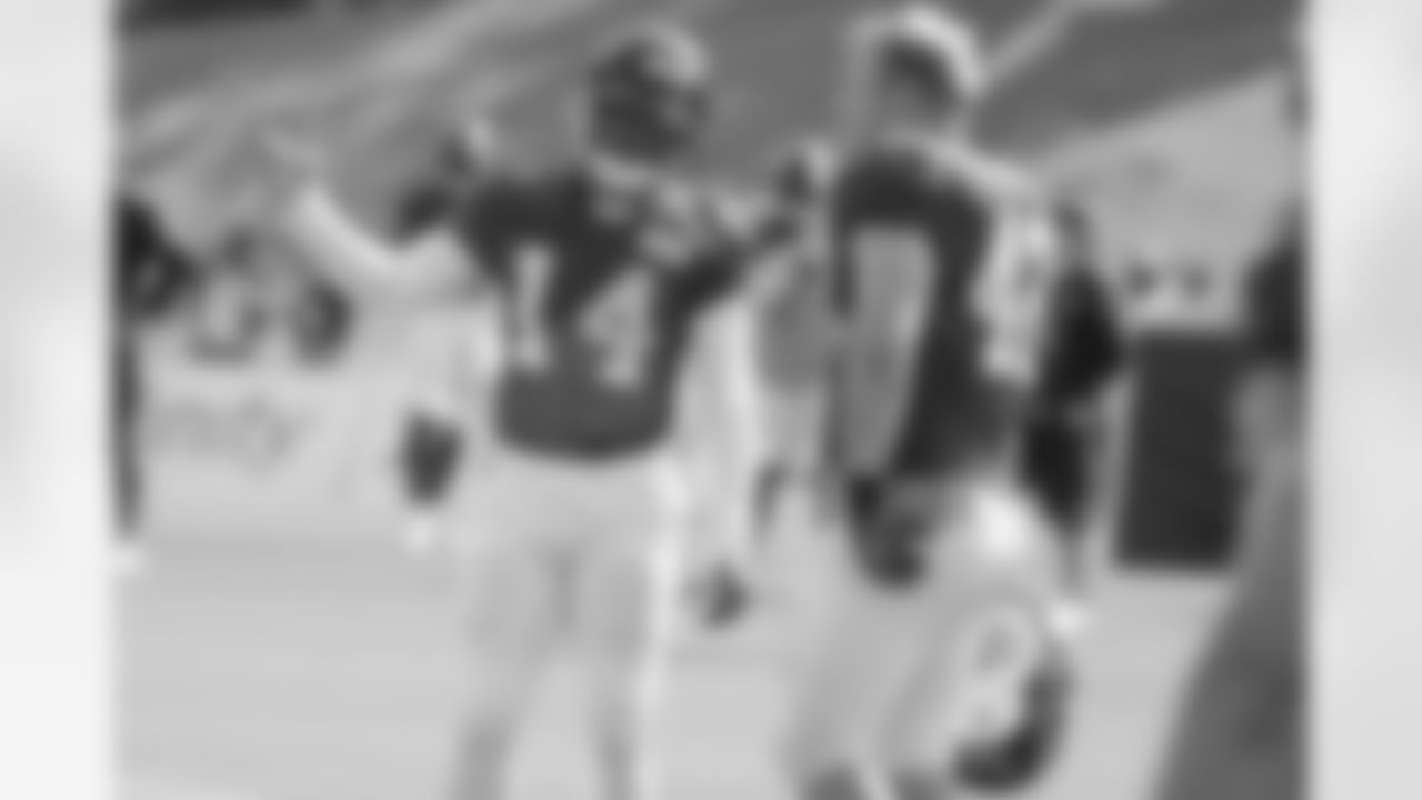 WR Eric Weems talks with FB Patrick DiMarco