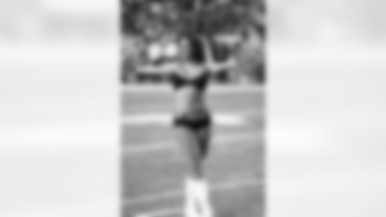 Atlanta Falcons Cheerleader Cecilia B. prepares for the players entrance // Falcons-Bengals Preseason Game - 2012 // August 16, 2012 // PHOTO: Art Morrison, Special to AtlantaFalcons.com