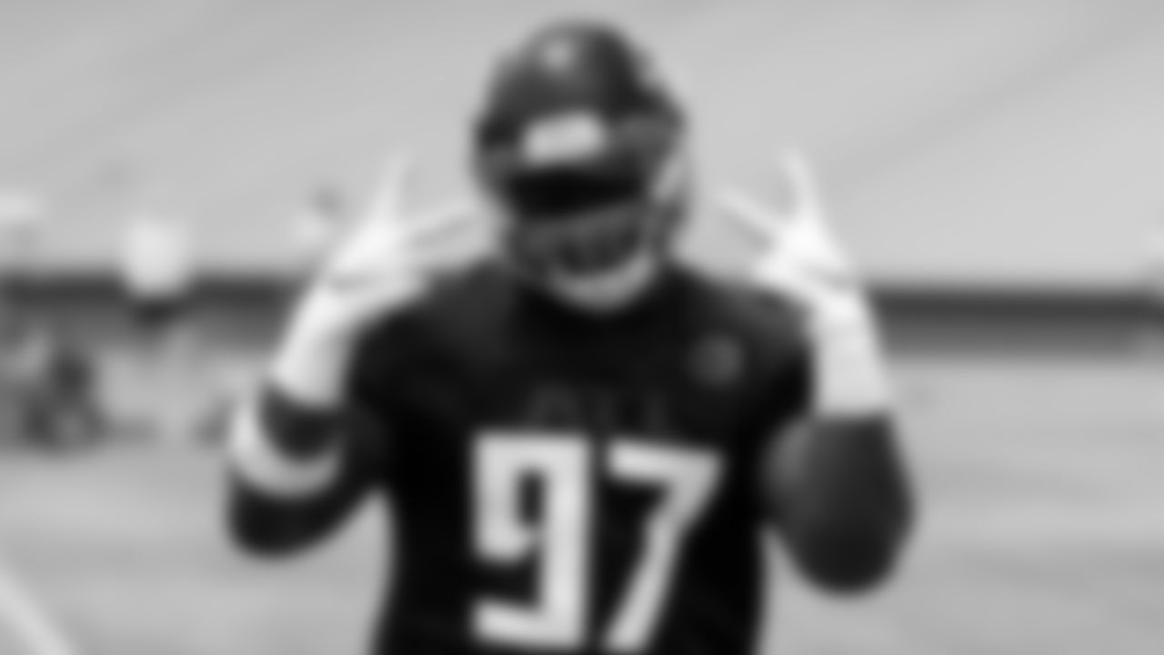 Atlanta Falcons defensive tackle Grady Jarrett #97 gestures during organized team activities in Phase III of the Atlanta Falcons offseason program on May 26, 2021.