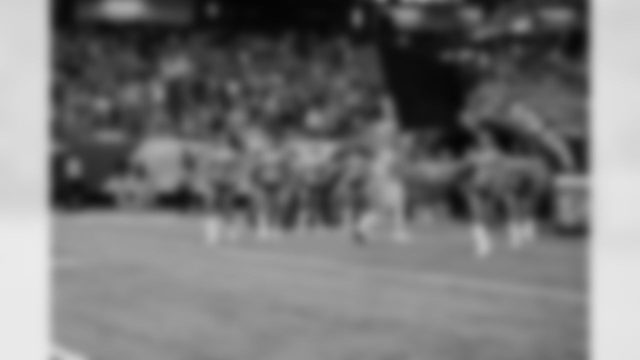 The Atlanta Falcons Cheerleaders run onto the field before the player intros for the Falcons vs. Raiders game