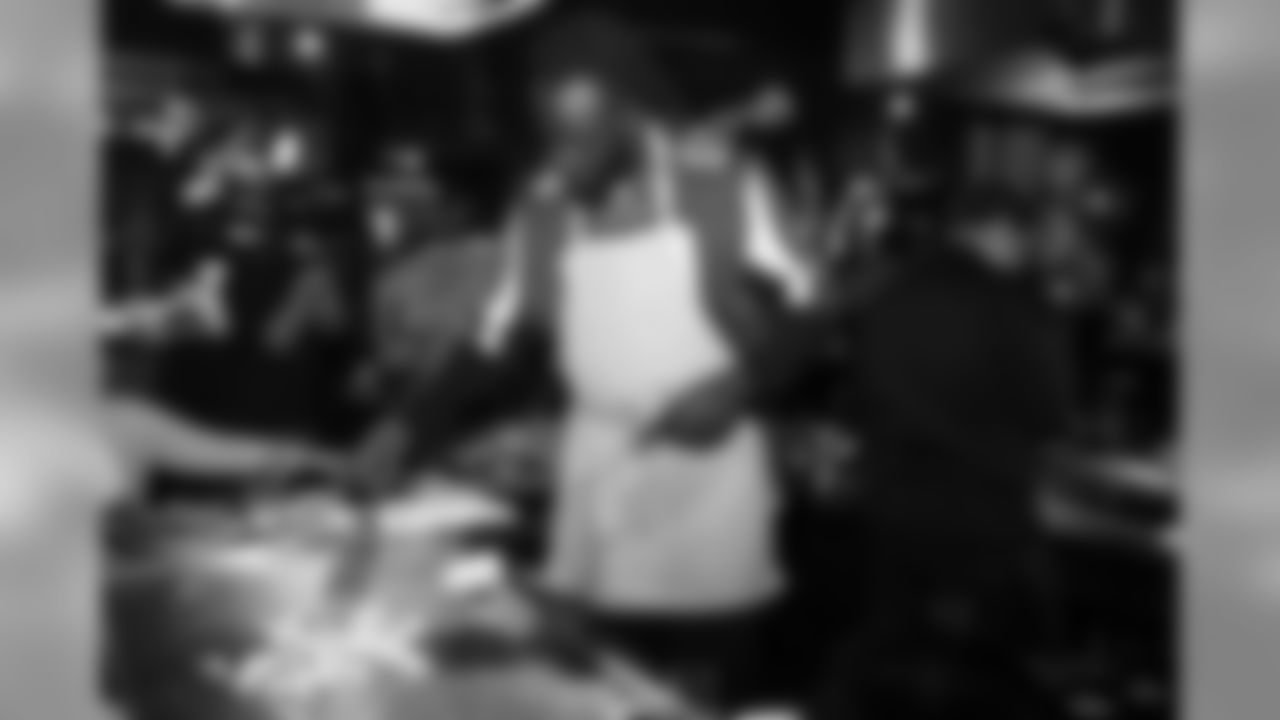 LB De'Vondre Campbell cooks during the annual Falcons Dazzle and Dine event