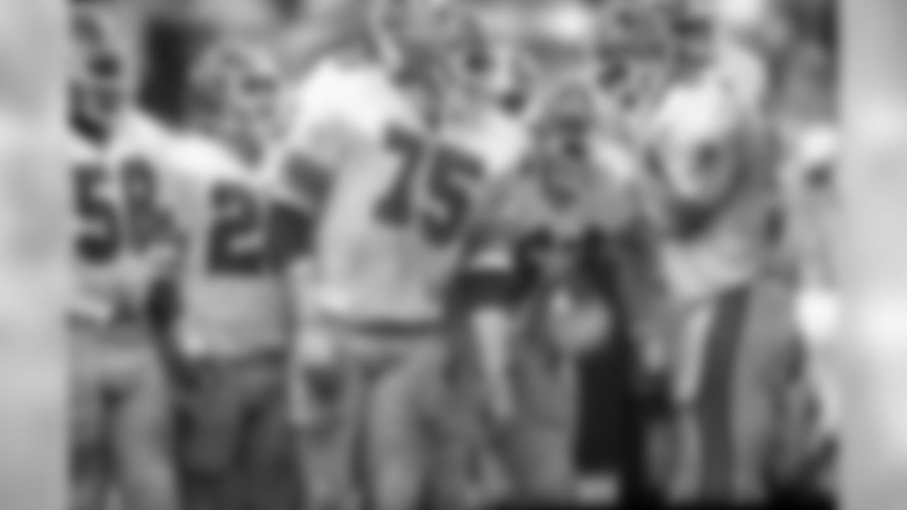 DE Jeff Merrow and LB Buddy Curry huddle with their teammates during an NFL game against the Los Angeles Rams on December 21, 1980. The Falcons defeated the Rams 21-10.
AP Photo / Peter Read Miller