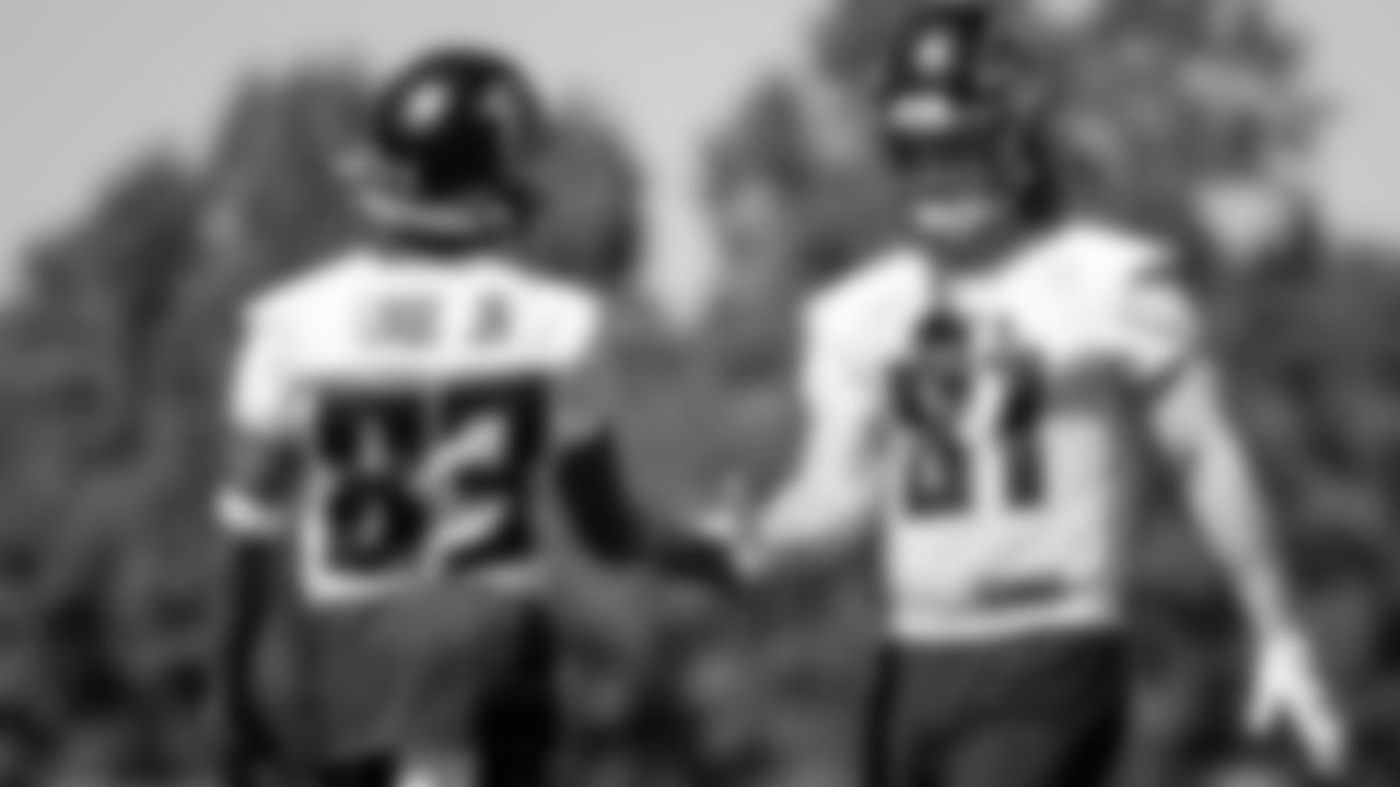 Atlanta Falcons wide receiver Russell Gage #83 shakes hands with tight end Hayden Hurst #81 during practice at IBM Performance Field. (Photo by Kara Durrette/Atlanta Falcons)