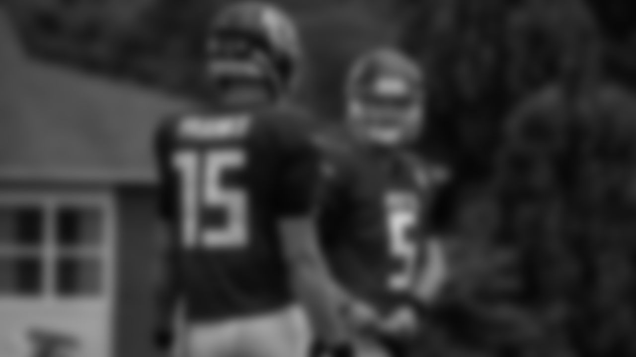 Atlanta Falcons quarterback AJ McCarron #5 talks to quarterback Feleipe Franks #15 during the AT&T Atlanta Falcons Training Camp at Atlanta Falcons Headquarters in Flowery Branch, Georgia, on Monday August 16, 2021. (Photo by )