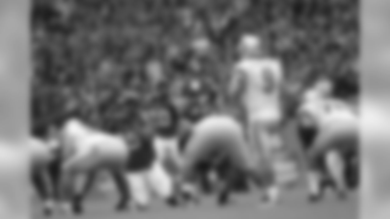 The defensive line lines up against the Lions