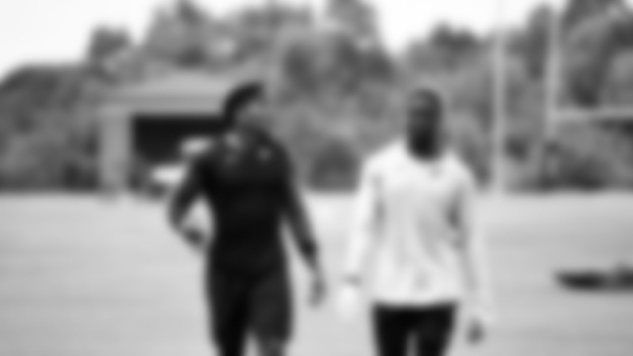 Atlanta Falcons linebacker Mykal Walker #43 walks with linebacker Foye Oluokun #54 during organized team activities in Phase III of the Atlanta Falcons offseason program on May 26, 2021.