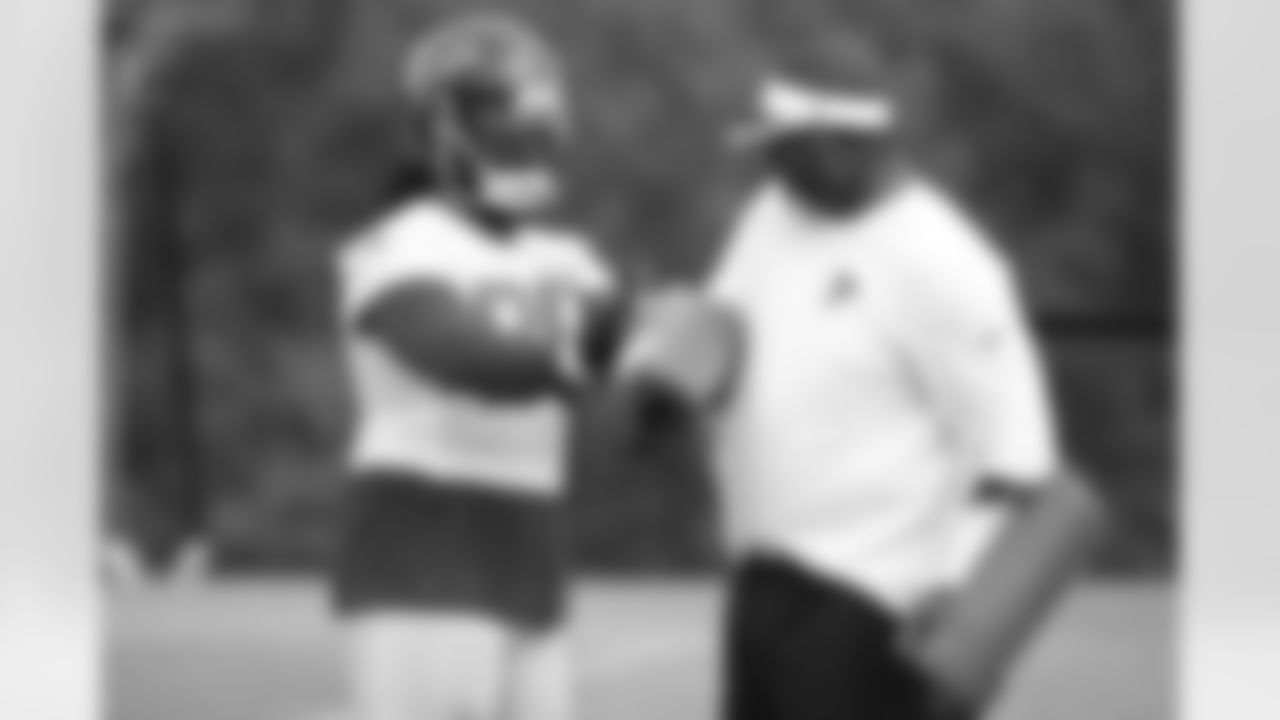DT Jonathan Babineaux works with defensive line coach Bryan Cox