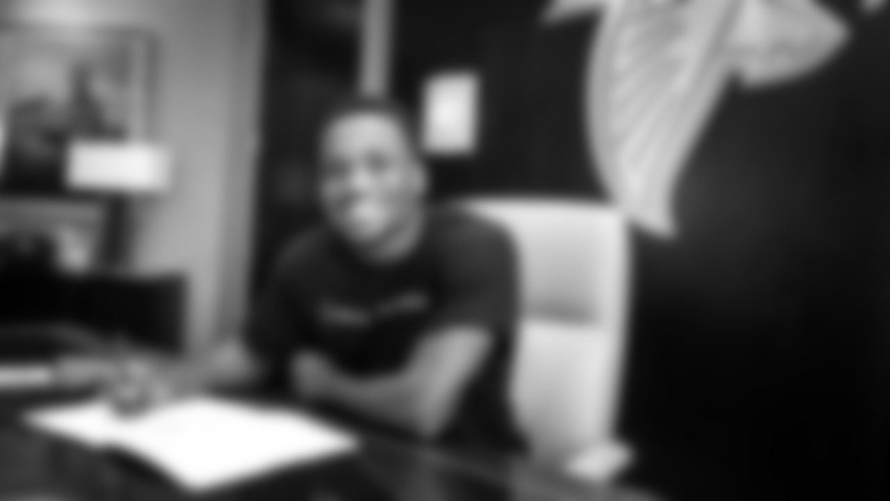 Atlanta Falcons cornerback Darren Hall #34 signing his contract to become an Atlanta Falcon on June 17, 2021 in Flowery Branch, GA.