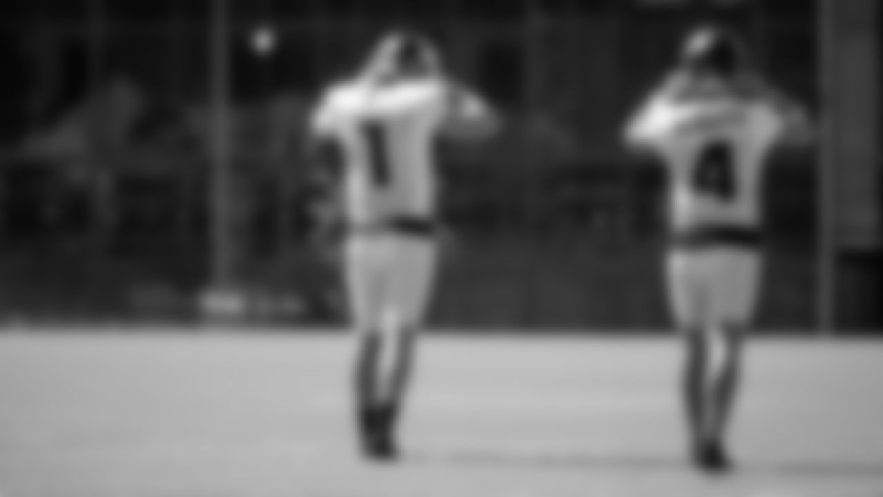 Atlanta Falcons kicker Elliott Fry #1 puts on his helmet with punter Sterling Hofrichter #4 during practice at IBM Performance Field. (Photo by Kara Durrette/Atlanta Falcons)