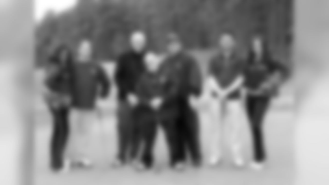WWE masked Superstar Rey Mysterio, middle, poses with his group // Wrestlemania Pro-Am Golf Tournament // 4/1/11 // The Frog, Villa Rica, Ga. -