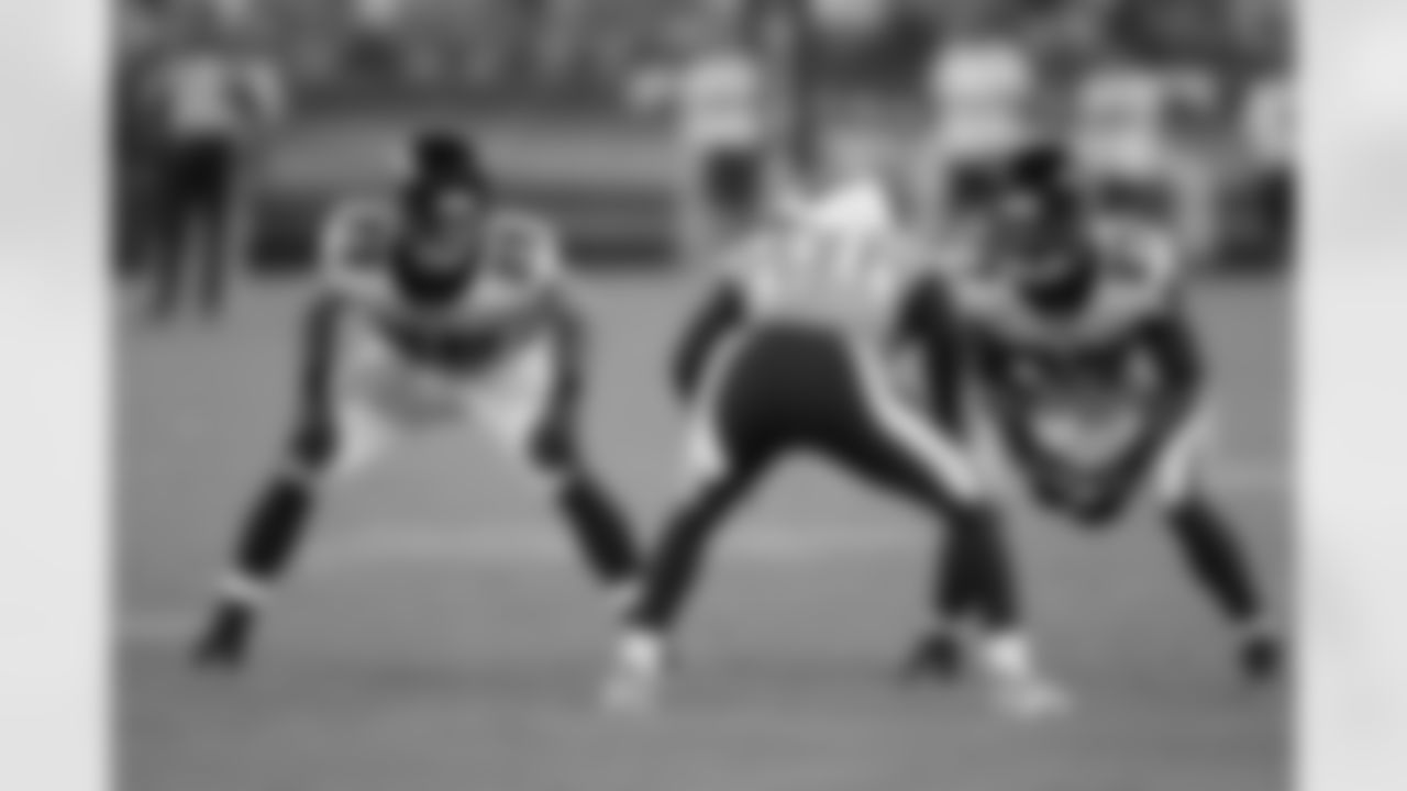 S Shann Schillinger and CB Robert McClain keep their eyes on Titans CB Coty Sensabaugh