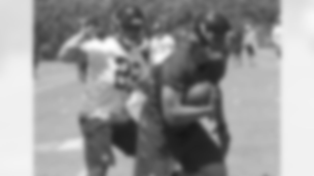 Austin Hooper works around first-round pick Keanu Neal after Neal made a simulated tackle during 7-on-7s
