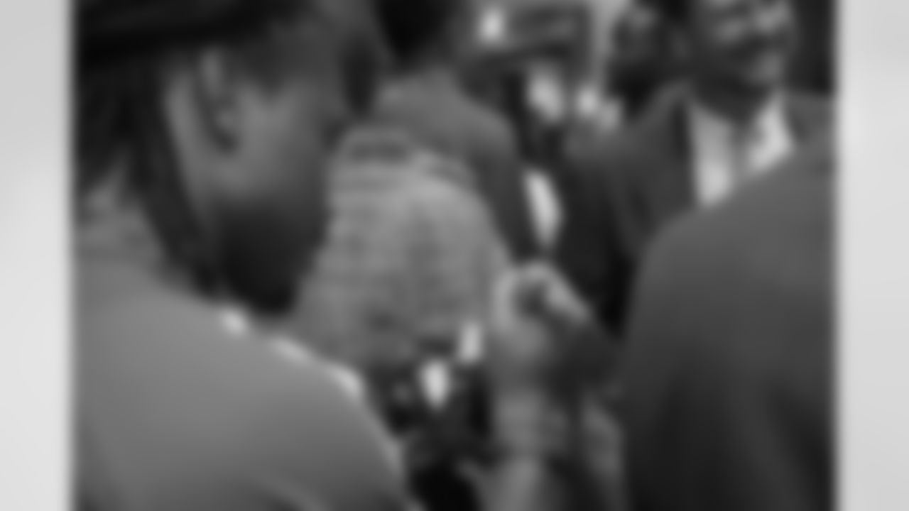 WR James Rodgers pens his name to a mini-helmet // Rookie Club Dinner - 2012 // May 29, 2012 // Atlanta -
