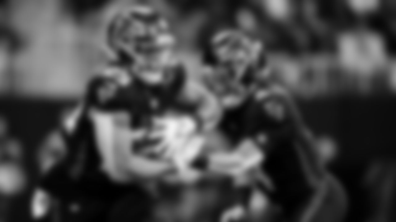 Atlanta Falcons quarterback Desmond Ridder #4 hands off to running back Tyler Allgeier #25 during the first quarter against the Tampa Bay Buccaneers at Mercedes-Benz Stadium in Atlanta, Georgia on Sunday, January 8, 2023. (Photo by Brandon Magnus/Atlanta Falcons)