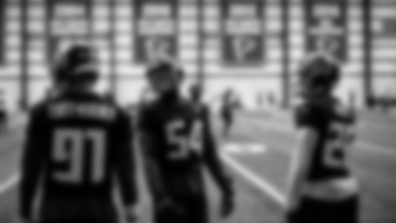 Atlanta Falcons linebacker Foye Oluokun #54, cornerback Isaiah Oliver #26 and defensive tackle Jacob Tuioti-Mariner #91 stand together during practice at IBM Performance Field.