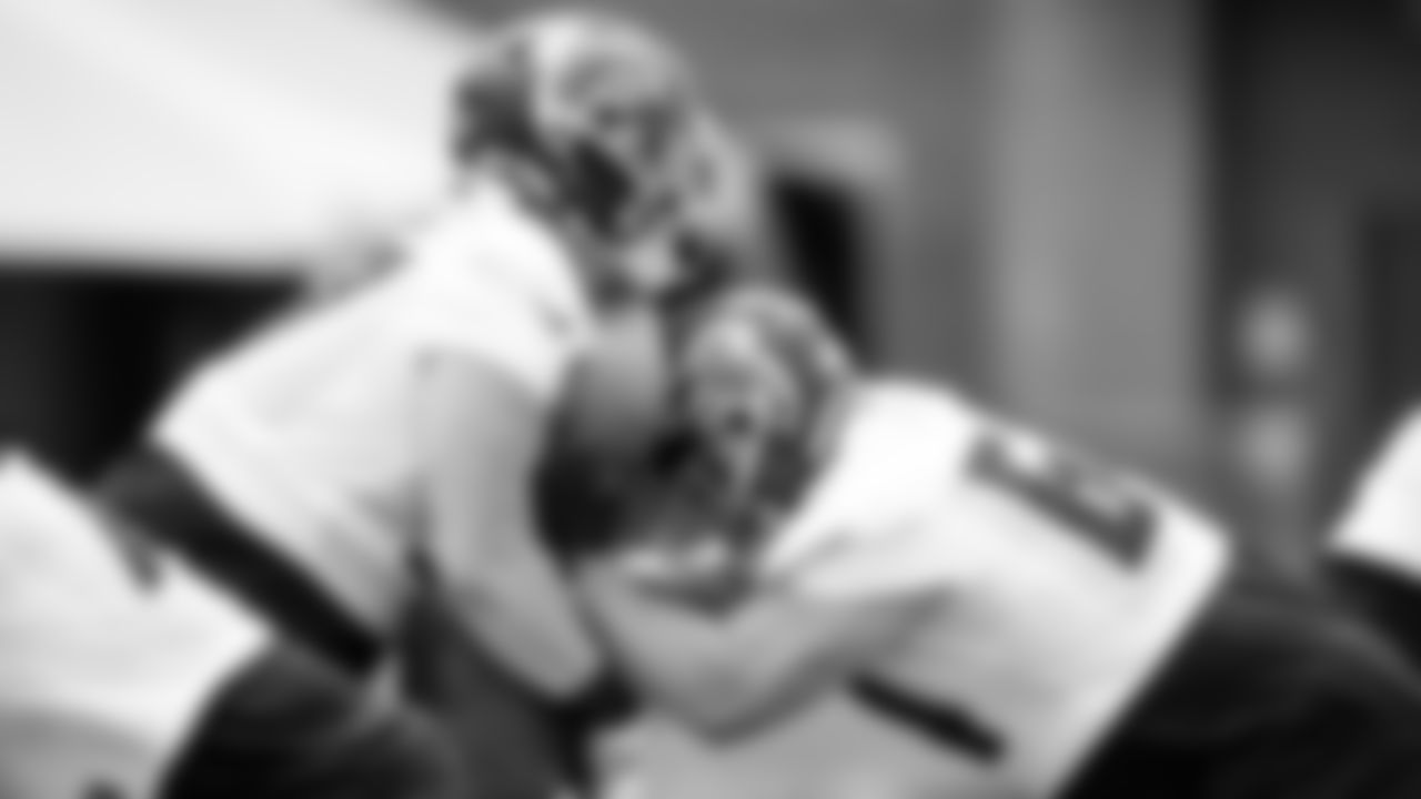Atlanta Falcons offensive lineman Ryan Neuzil #64 works with offensive lineman Jalen Mayfield #77 during organized team activities in Phase III of the Atlanta Falcons offseason program on June 2, 2021.