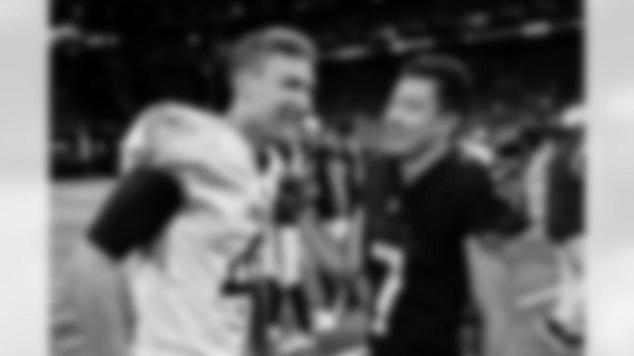 Atlanta Falcons kicker Younghoe Koo #7 shares a moment with the a Titans player after the Falcon's pre-season game against the Tennessee Titans at Mercedes-Benz Stadium in Atlanta, Georgia on Friday, August 13, 2021. (Photo by Brandon Magnus/Atlanta Falcons)