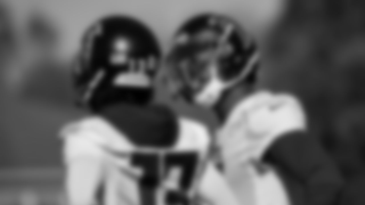 Atlanta Falcons wide receiver Julio Jones #11 talks to wide receiver Christian Blake #13 during practice at IBM Performance Field.
