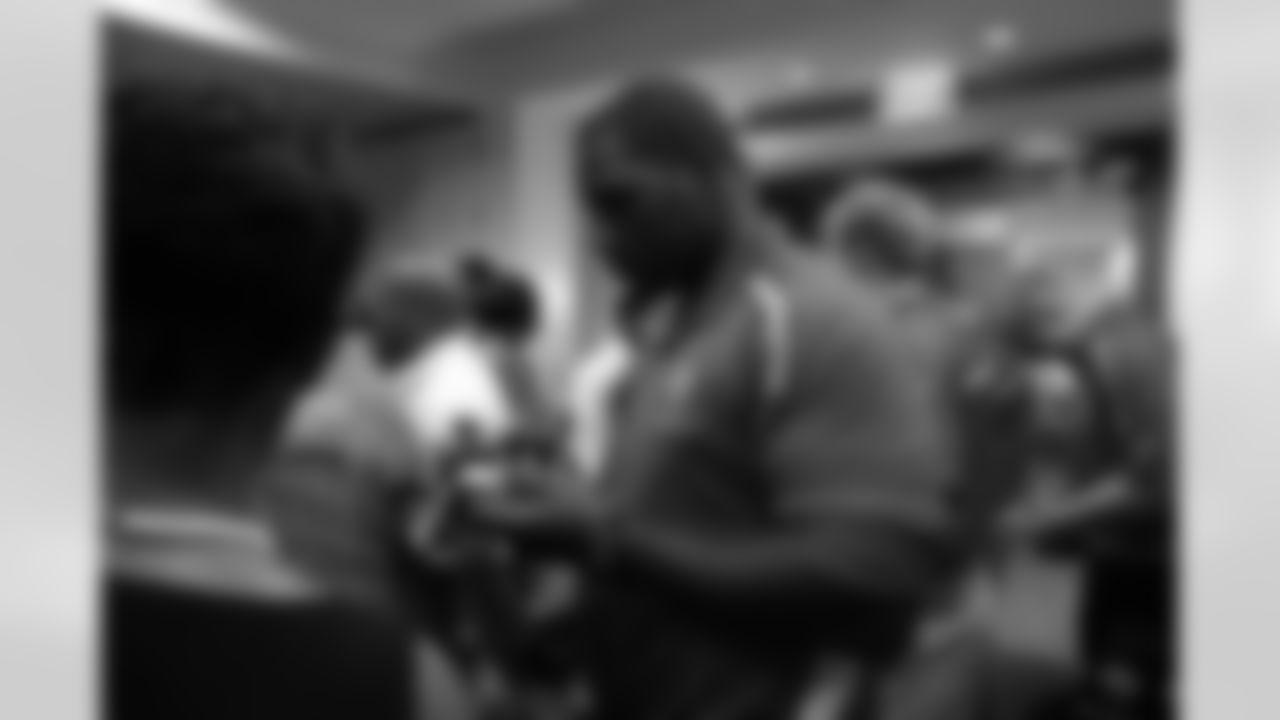 DT Micanor Regis gives out an autograph // Rookie Club Dinner - 2012 // May 29, 2012 // Atlanta -