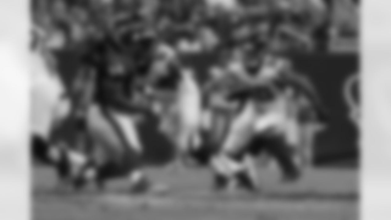 RB Josh Vaughan follows a block by C Joe Hawley.