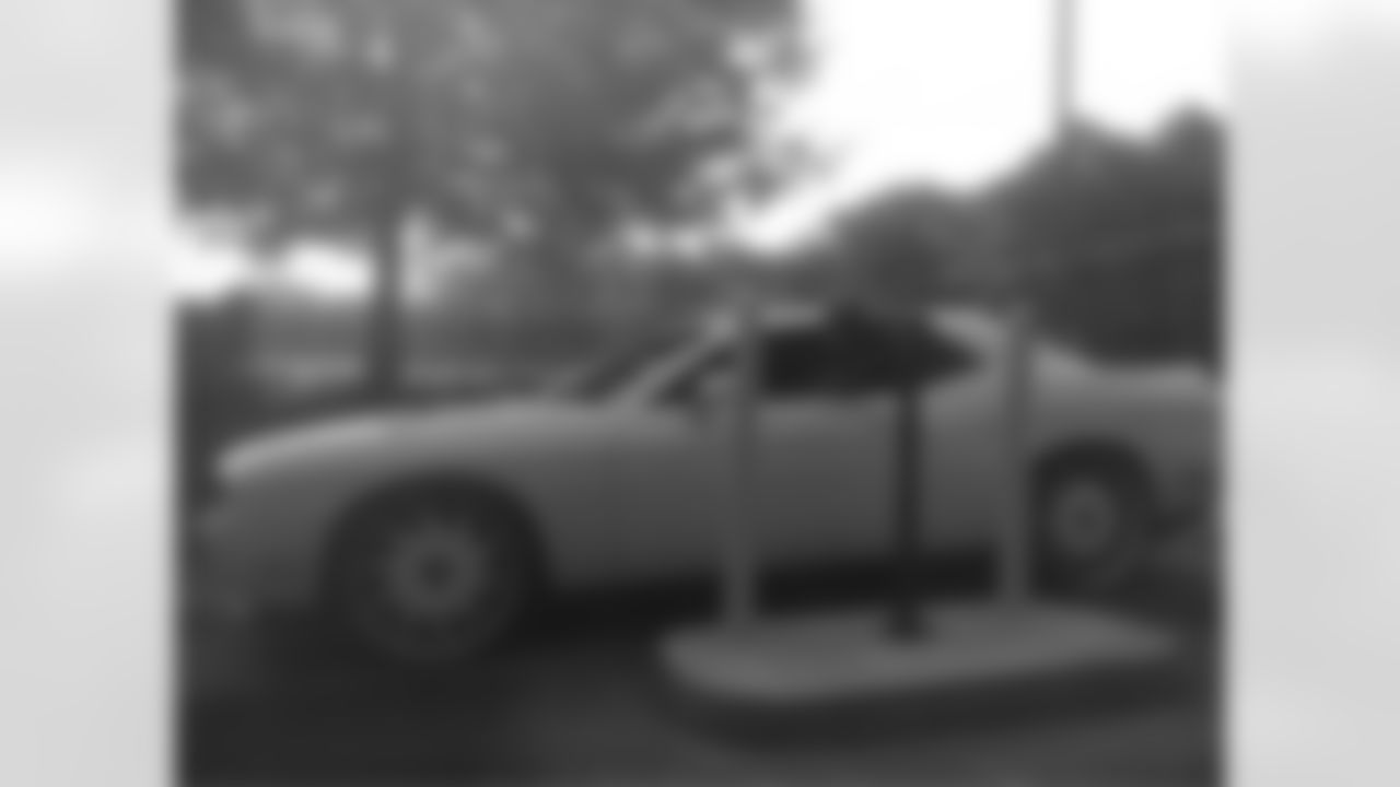 Running back Gartrell Johnson shows up in his new ride // Players Arrive in Flowery Branch // July 26, 2011 // Flowery Branch, Ga. -