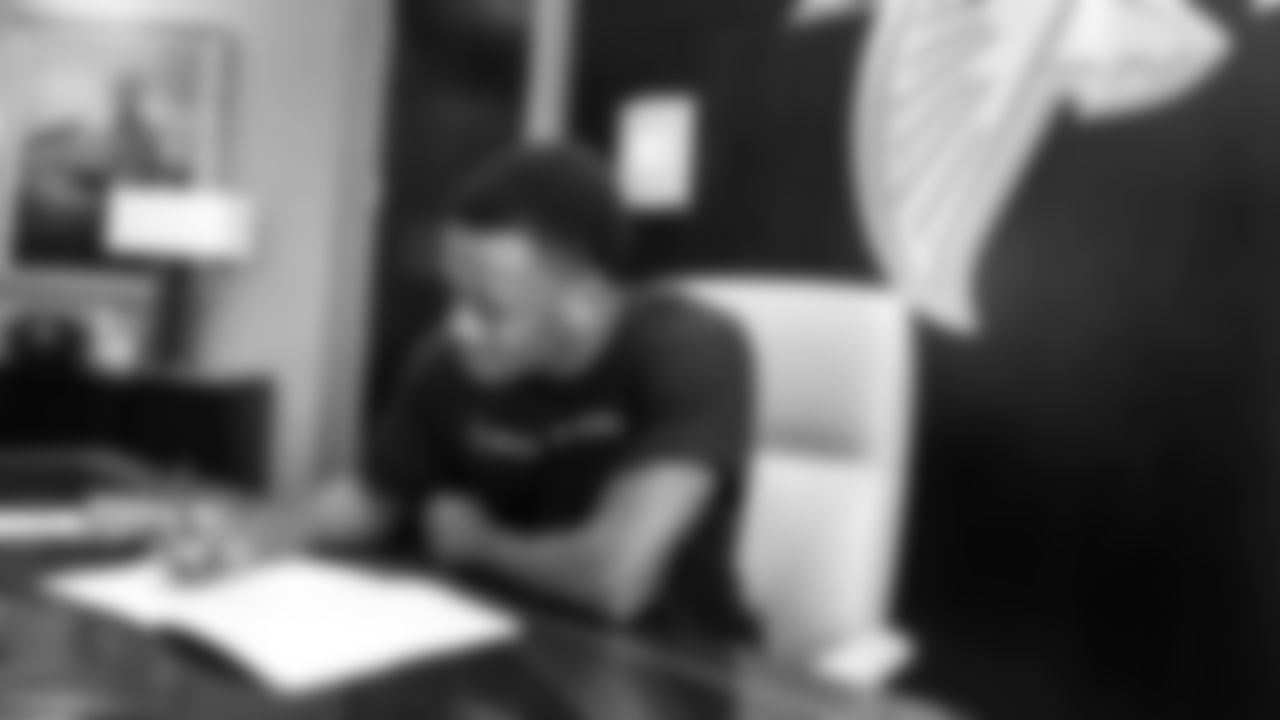 Atlanta Falcons cornerback Darren Hall #34 signing his contract to become an Atlanta Falcon on June 17, 2021 in Flowery Branch, GA.