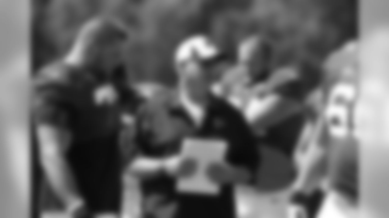Offensive line coach Paul Dunn works with the offensive line