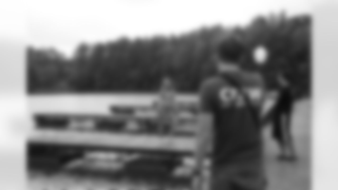 Kristine M. takes her photos on a dock