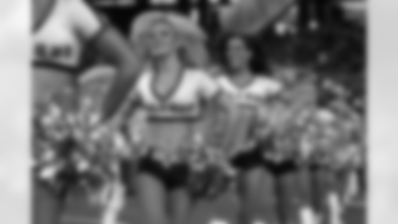 The Falcons Cheerleaders lead the team onto the field // Falcons vs. Dolphins - Cheerleaders // August 12, 2011 // Atlanta -