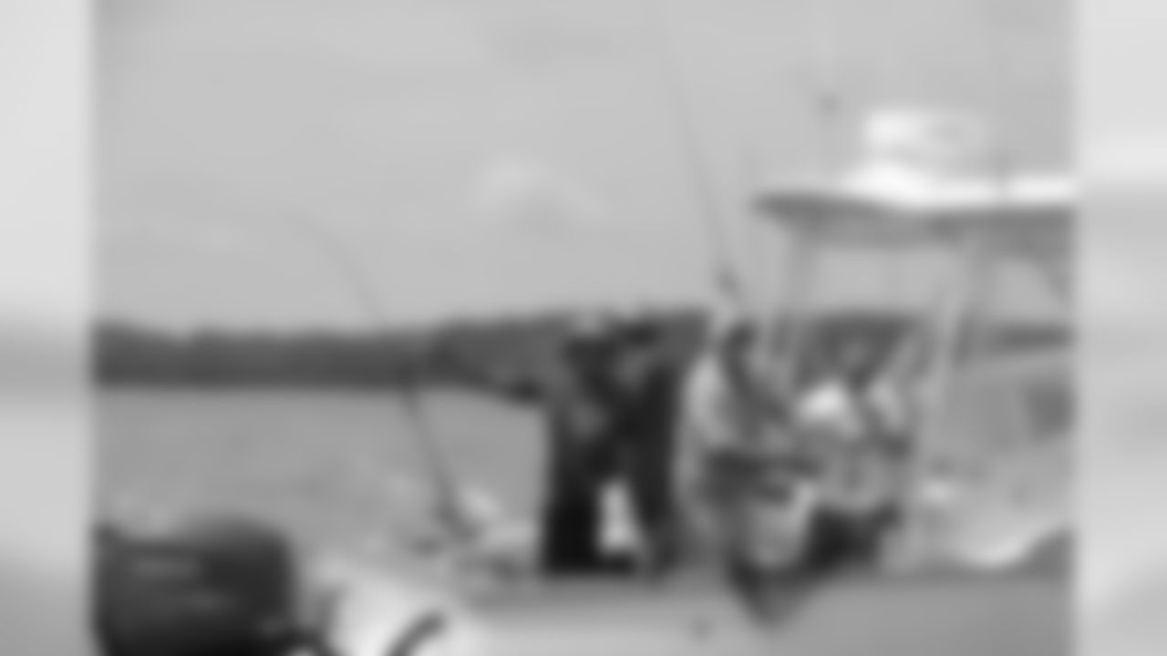 Atlanta Falcons players, coaches and cheerleaders spent Tuesday with wounded veterans during the fifth annual Fishing with the Falcons event on Lake Lanier // Fishing with the Falcons - 2012 // June 12, 2012 // Buford, Ga. -