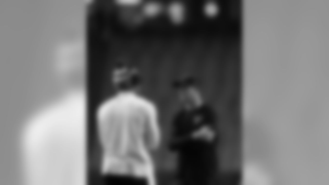 QB Matt Ryan talks to Panthers QB Cam Newton