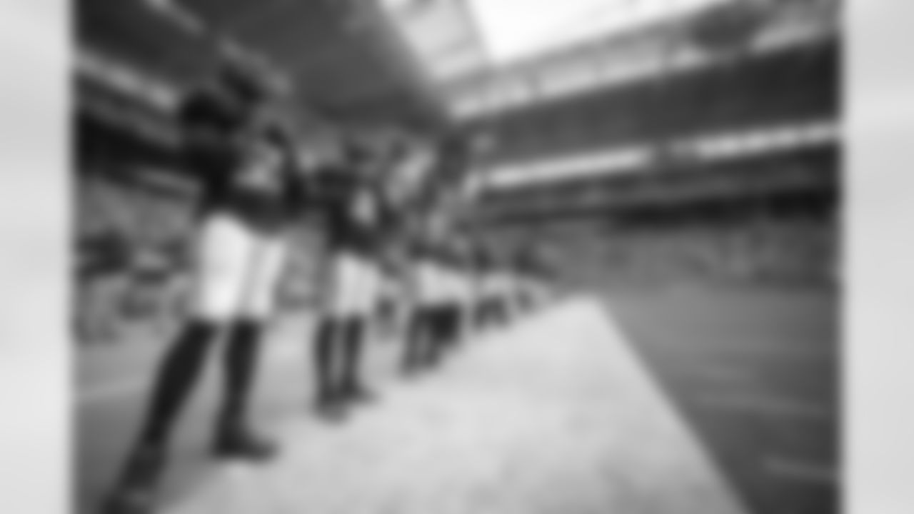 The Atlanta Falcons are seen during the national anthem prior to a game against the Miami Dolphins at Hard Rock Stadium in Miami Gardens, Florida on Sunday, October 24, 2021. (Photo by Mark Brown/Atlanta Falcons)