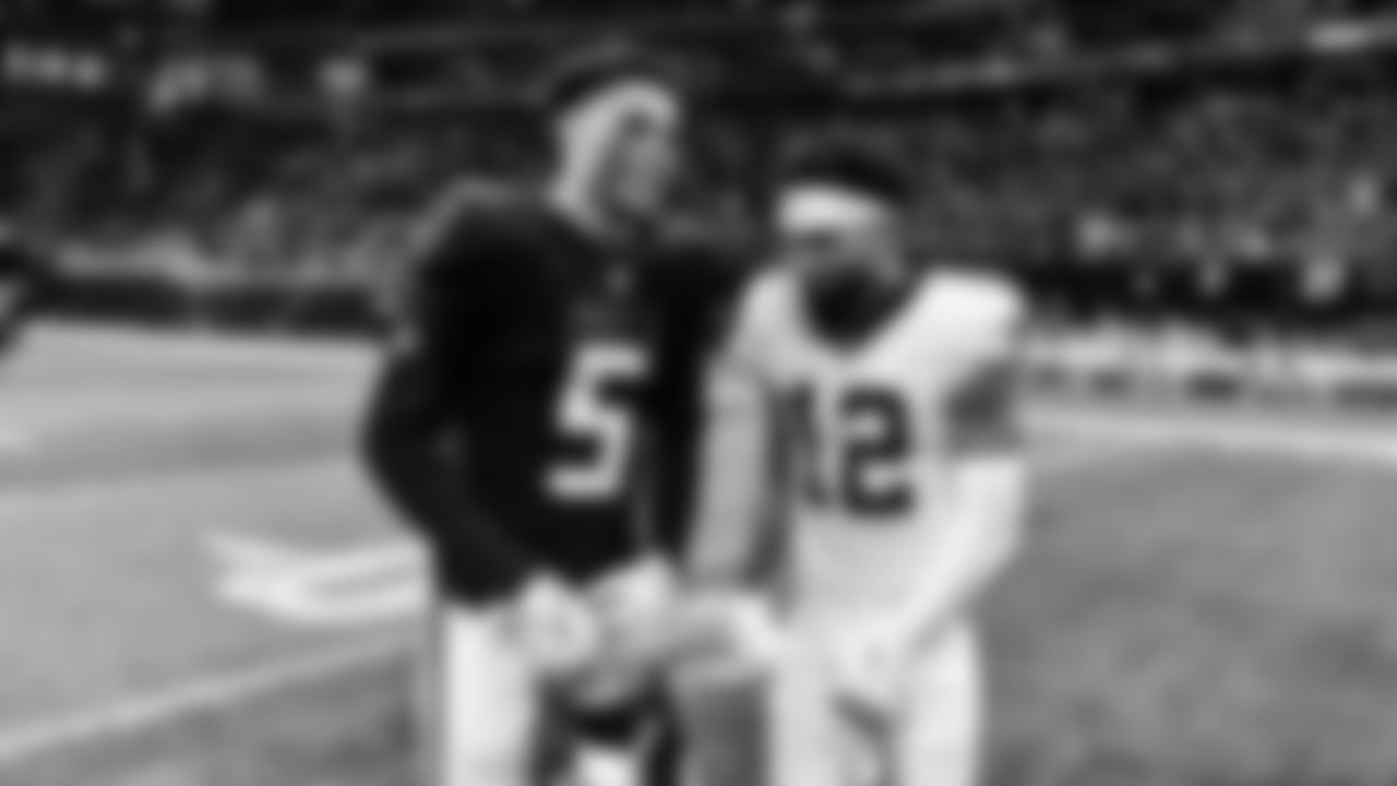 Atlanta Falcons wide receiver Drake London #5 and a Saints player interact after the game against the New Orleans Saints at Mercedes-Benz Stadium in Atlanta, Georgia on Sunday, September 11, 2022. (Photo by Kyle Hess/Atlanta Falcons)