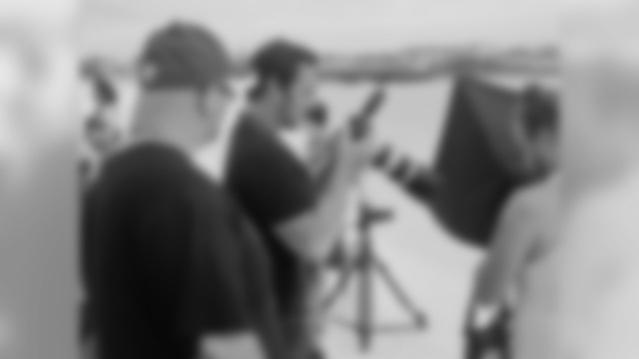 Photographer Drew Crozier and Falcons Creative Services Director Mike Benford check out some shots // Atlanta Falcons Cheerleaders Swimsuit Calendar Photo Shoot - Day 1 // 5/26/11 // Bermuda -