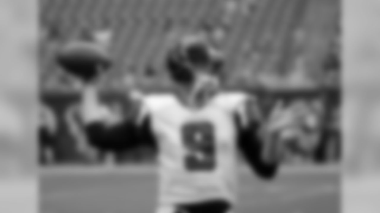 QB Jeff Mathews throws around a football during warm-ups.