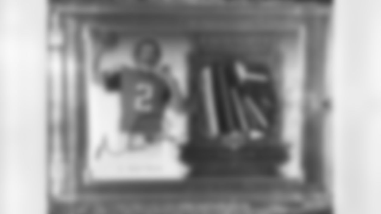 Stone Sour guitarist Josh Rand shows off just one of the many pieces of Falcons memorabilia he owns