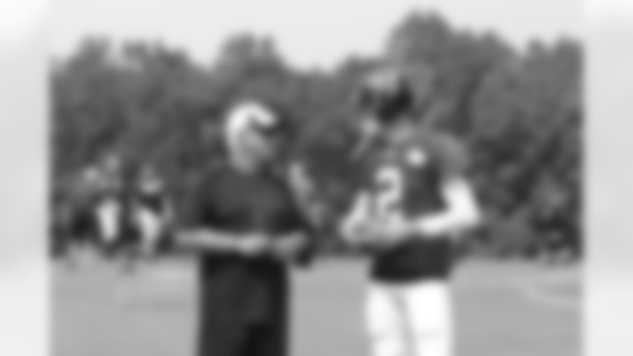 Head coach Mike Smith talks to QB Matt Ryan