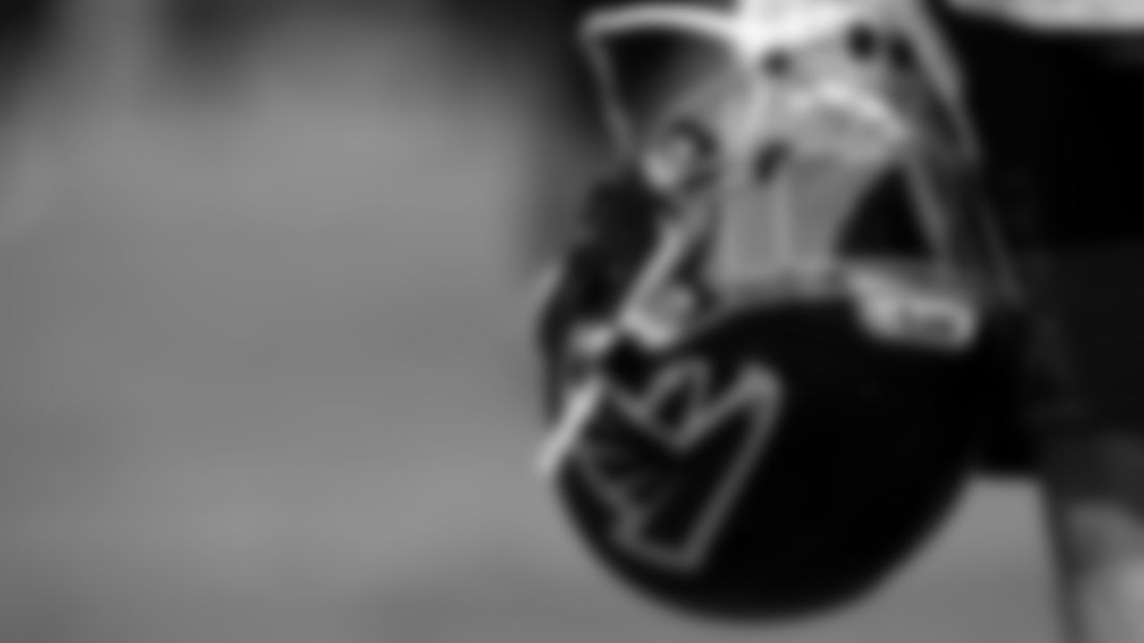 A generic image of a player holding a helmet during organized team activities in Phase III of the Atlanta Falcons offseason program on May 25, 2021.