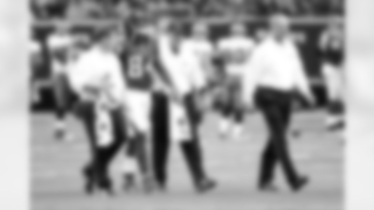 WR Roddy White is escorted off the field by team trainers in the first quarter // Falcons vs Buccaneers // 11/7/10 - Georgia Dome