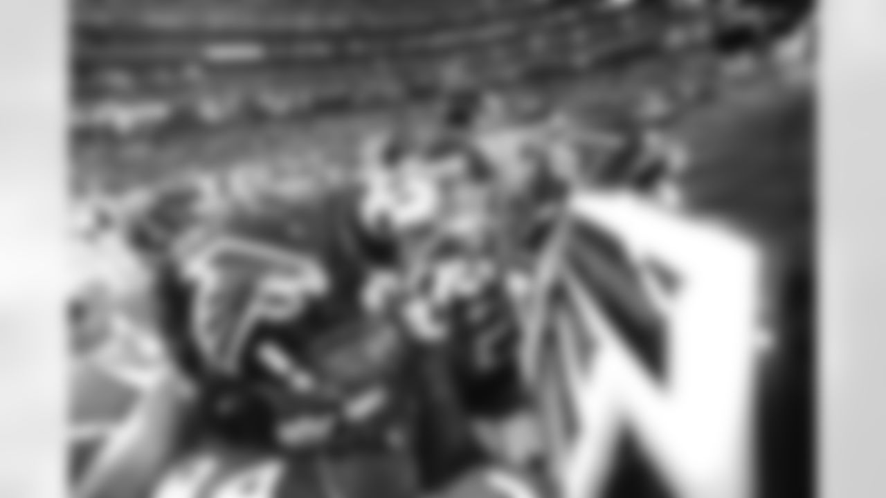 The Falcons huddle one last time before kickoff