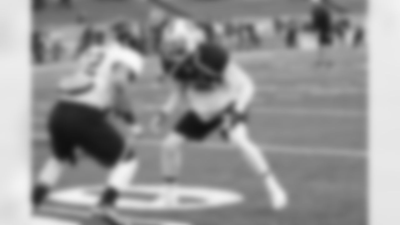 Northwestern WR Kain Colter works against North Carolina State CB Dontae Johnson.