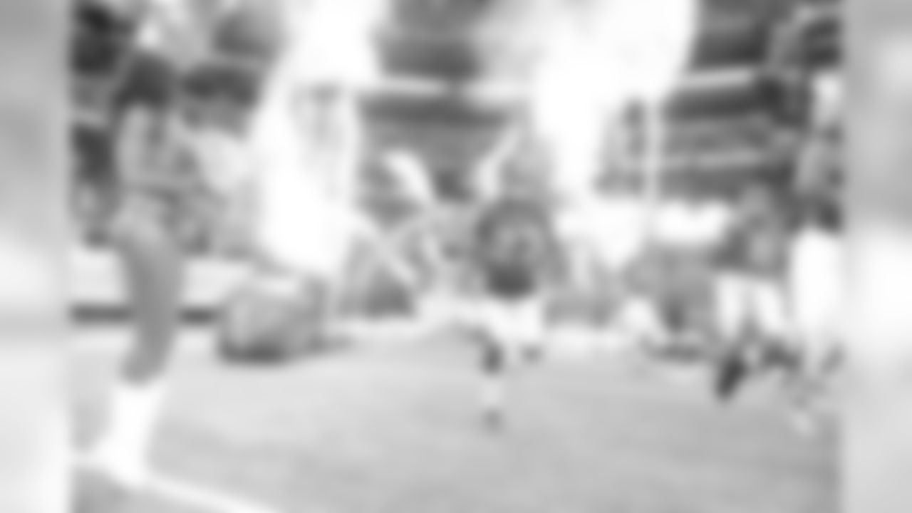 CB Robert Alford runs onto the field with his teammates