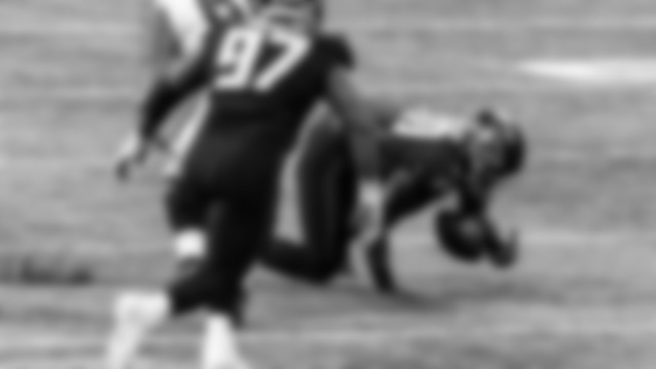 Atlanta Falcons defensive tackle Marlon Davidson #90 attempts to control a fumble against the Las Vegas Raiders on November 29, 2020.