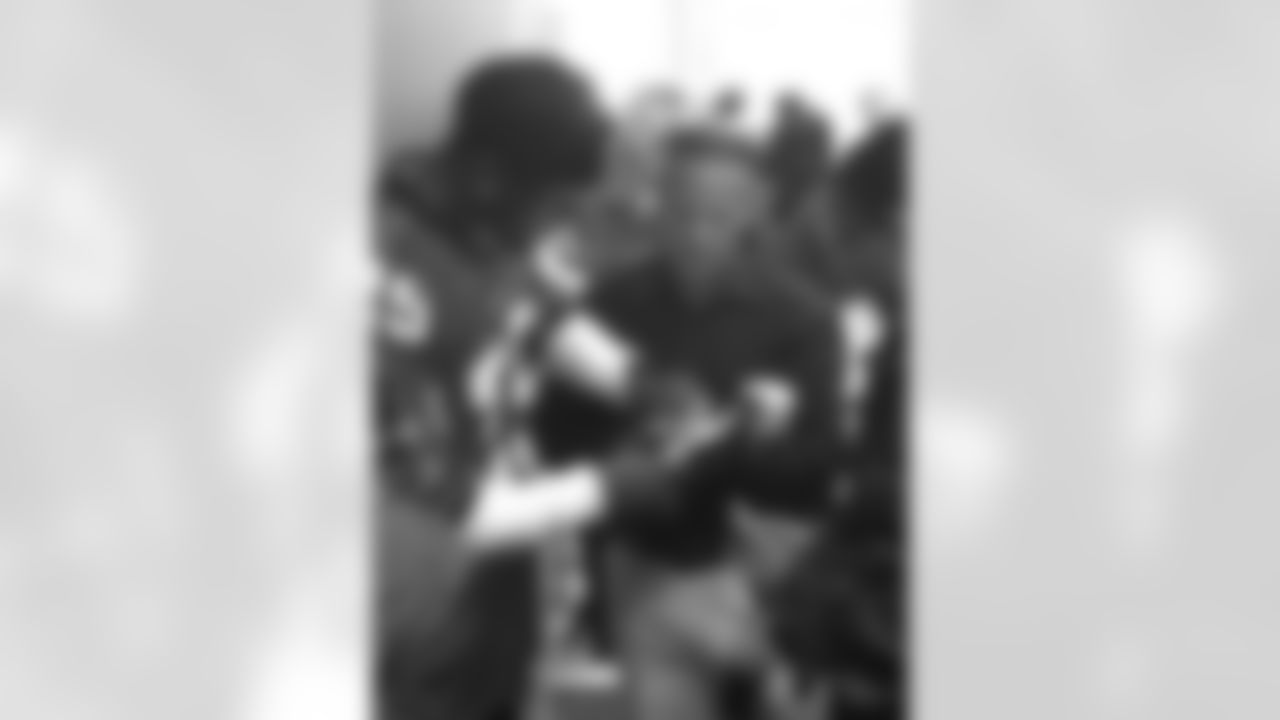 William Moore signs an autograph on an iPad inside the terminal // Trading Places - AirTran // Nov. 1, 2011 // Atlanta -