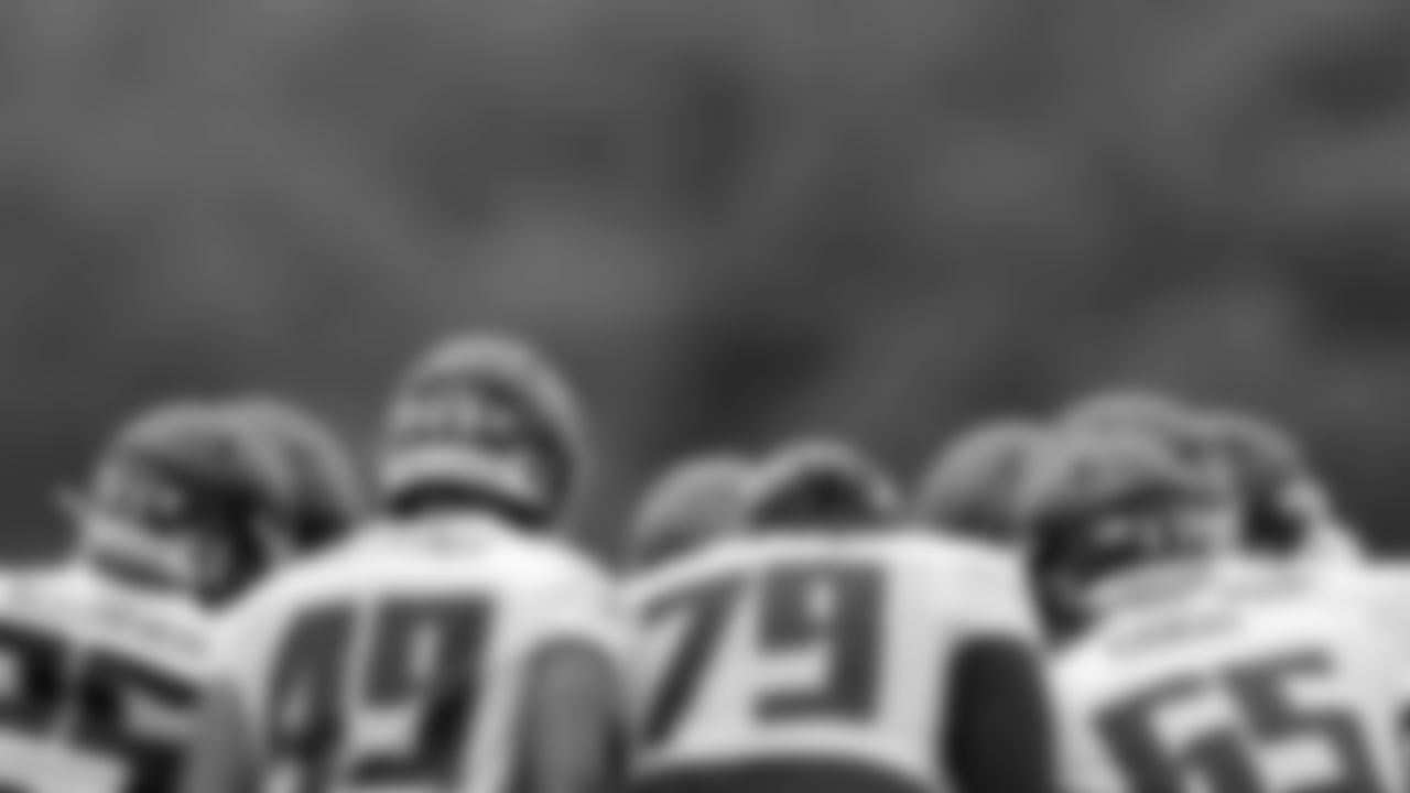 View of an offensive line huddle during rookie minicamp practice in Flowery Branch, Georgia, on Friday, May 13, 2022. (Photo by Shanna Lockwood/Atlanta Falcons)