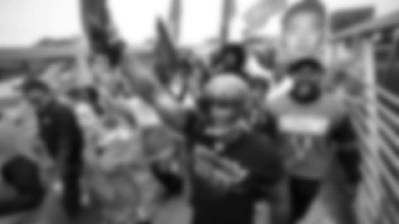 Fans march in the Dirty Birds Nest March before the game against the Carolina Panthers at Mercedes-Benz Stadium in Atlanta, Georgia on Sunday, October 30, 2022. (Photo by Jay Bendlin/Atlanta Falcons)