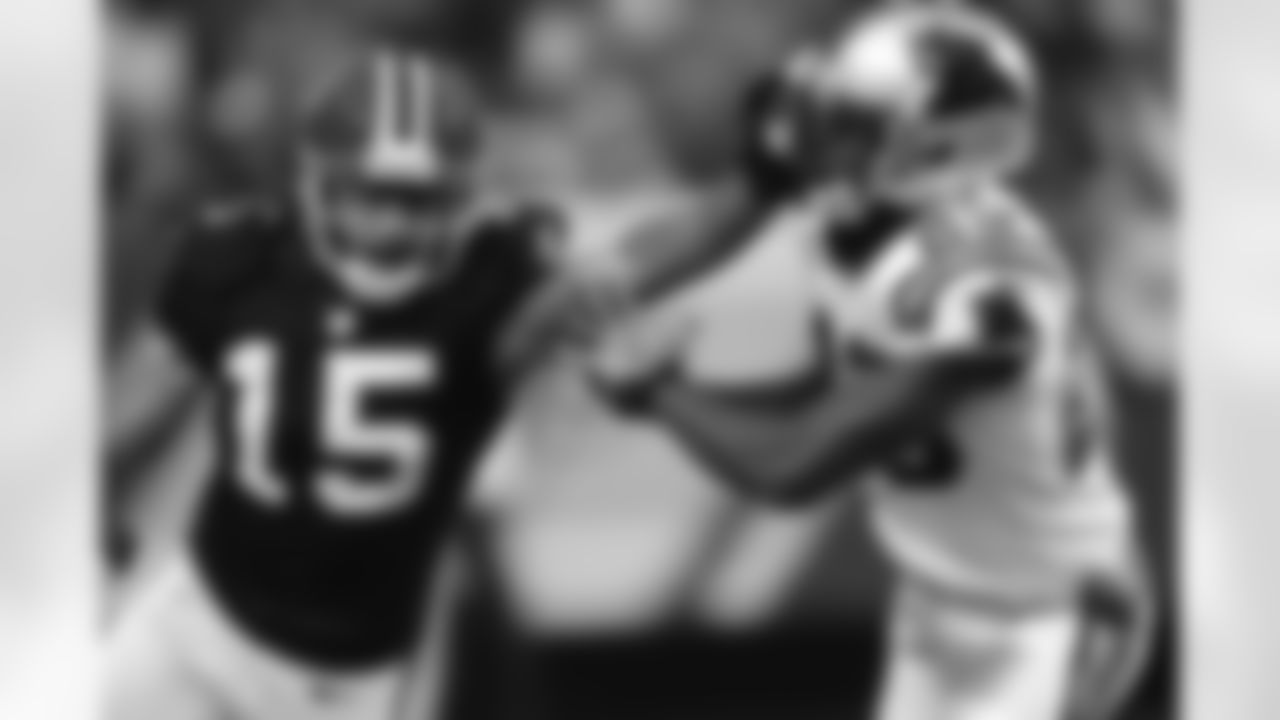 WR Kevin Cone stiff arms a Carolina defender